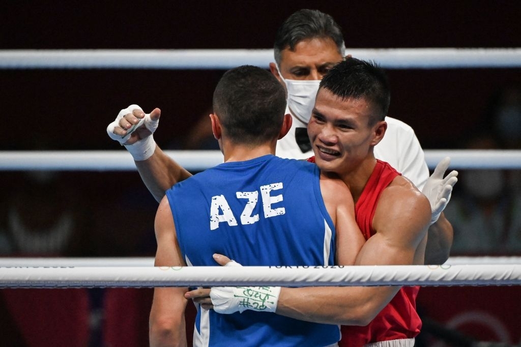 Tin cực vui tại Olympic: Võ sĩ boxing Nguyễn Văn Đương đấm ngã đối thủ, xuất sắc tiến vào vòng 1/8 - Ảnh 3.