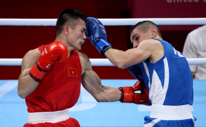 Ảnh: Nguyễn Văn Đương vượt qua đối thủ mạnh, giúp boxing Việt Nam có chiến thắng lịch sử sau 33 năm - Ảnh 4.